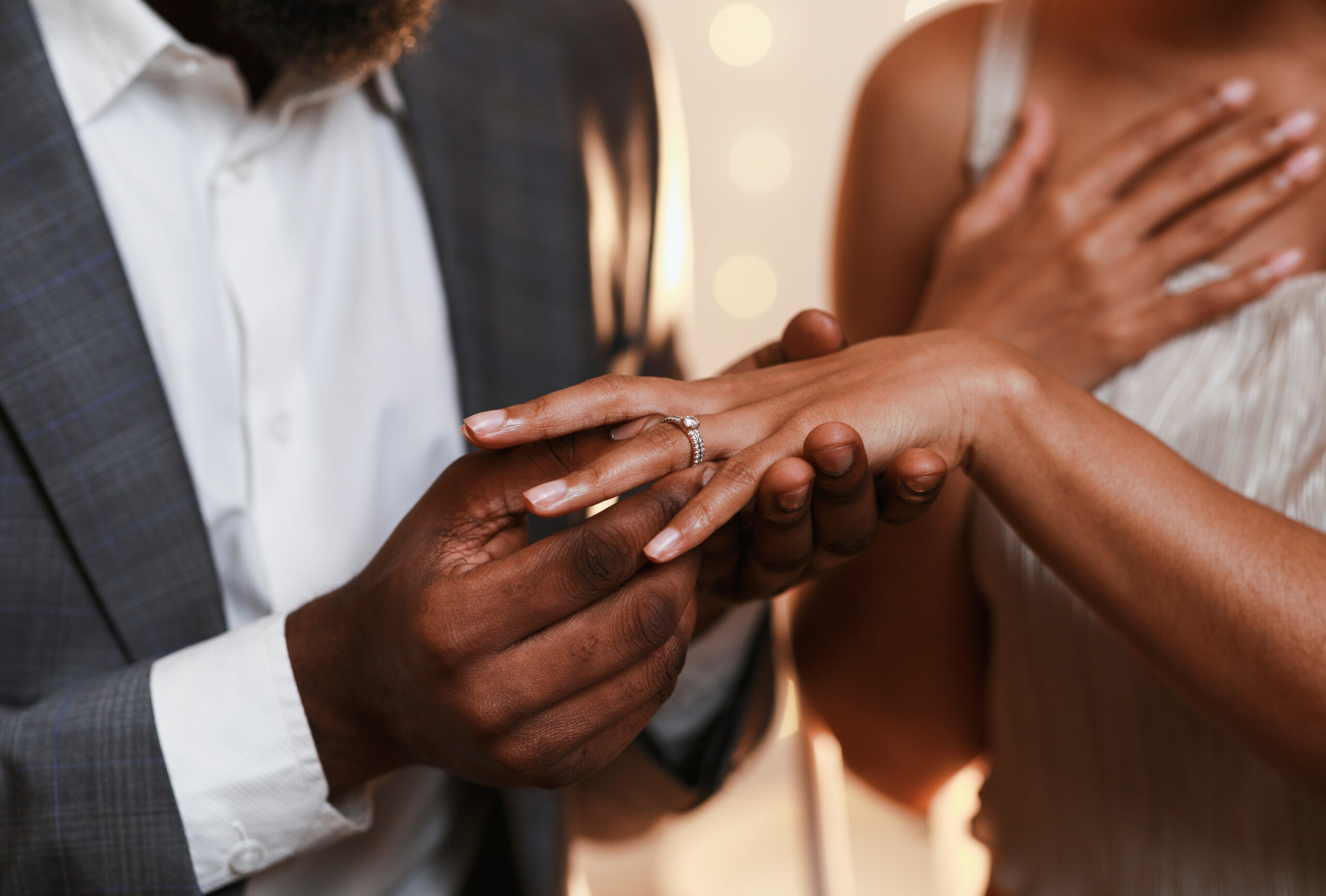 Couple exchanging wedding rings close up