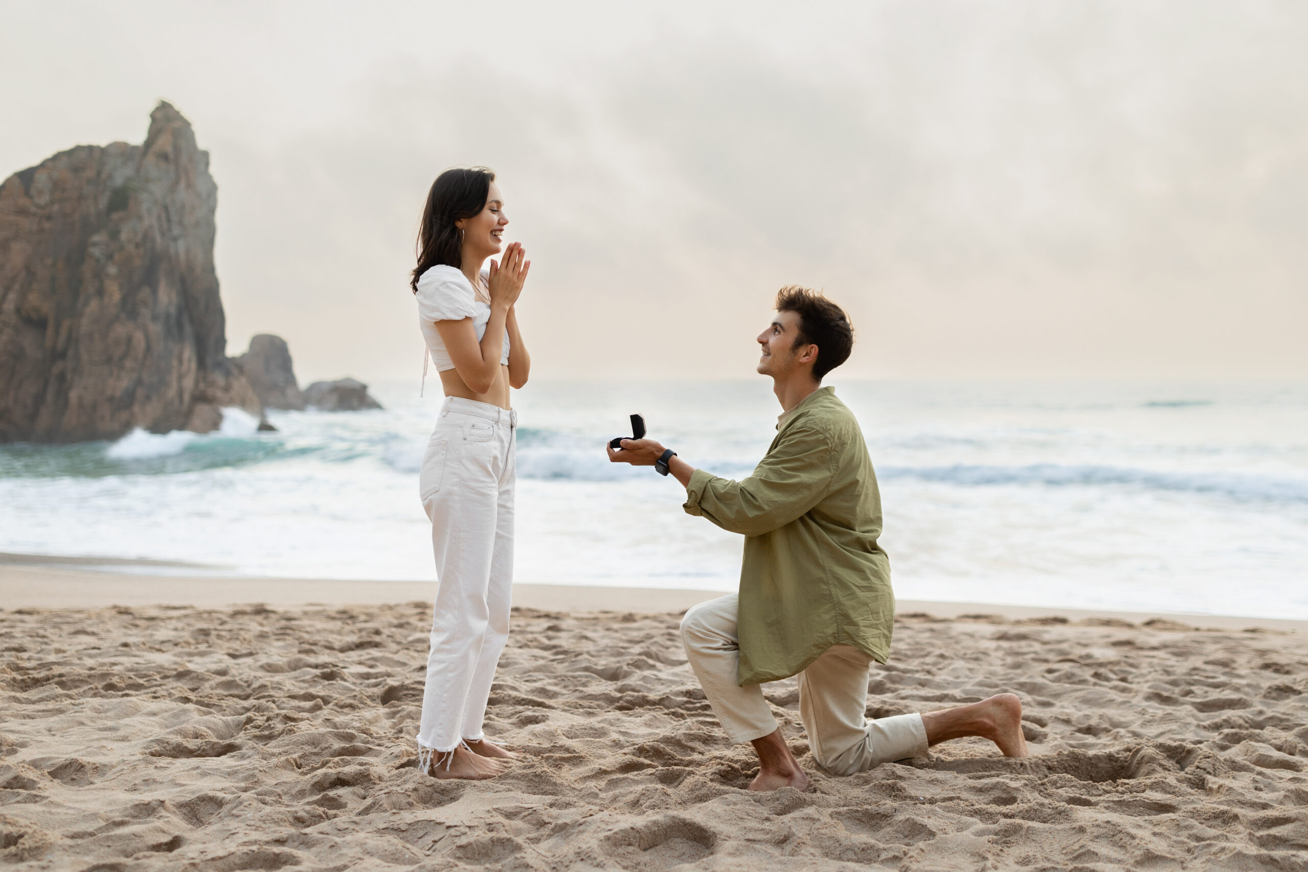 Beach proposal with diamond engagement ring